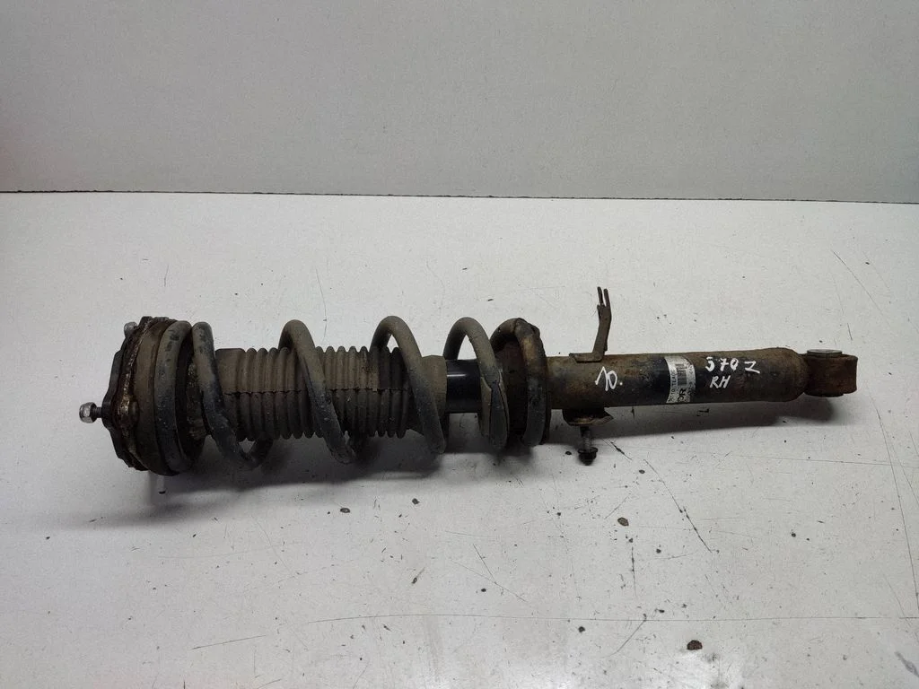 Front shock absorber with coil spring 561101EA0C