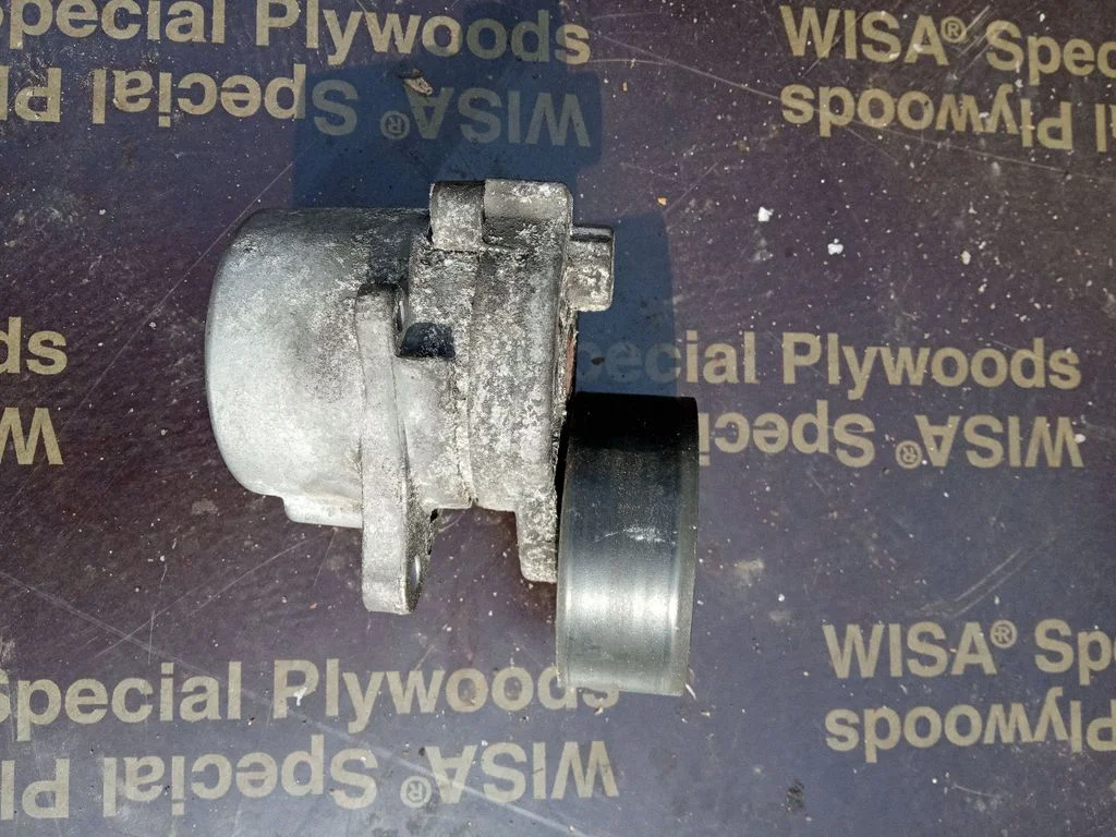 Alternator belt tensioner