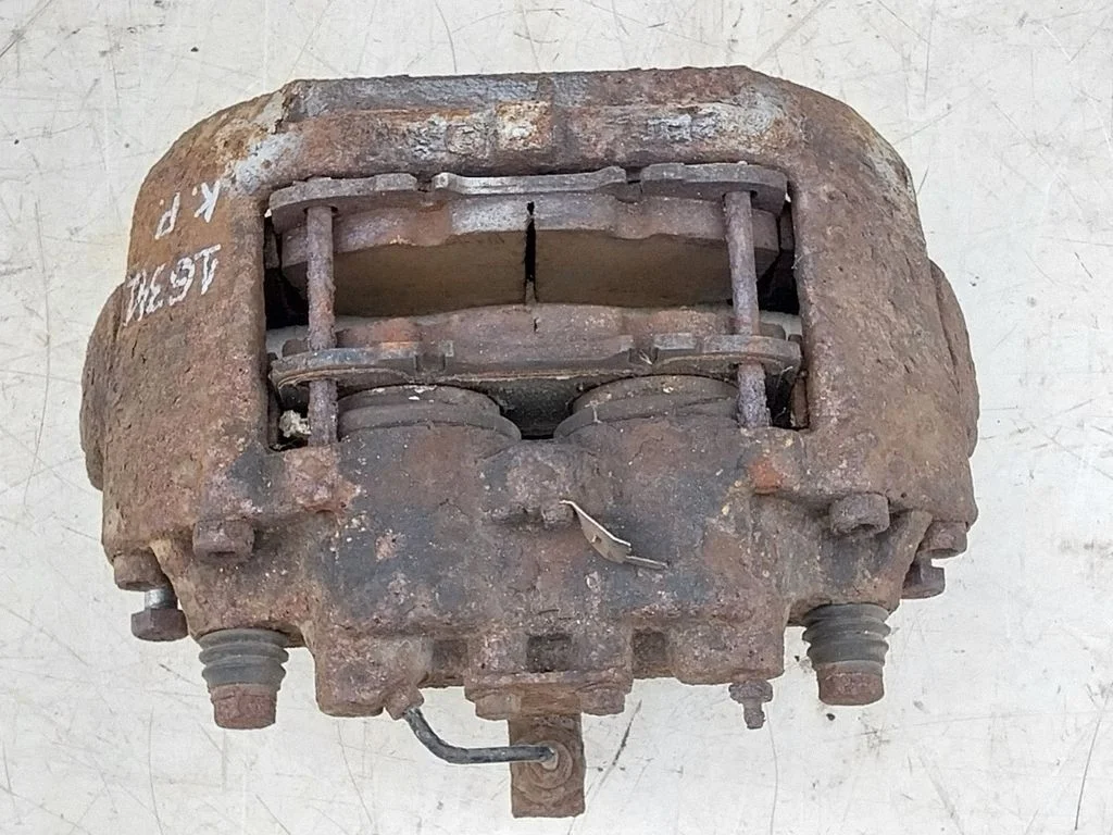Front brake caliper 504121785