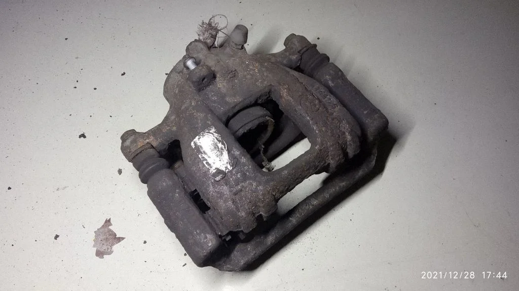 Rear brake caliper – left