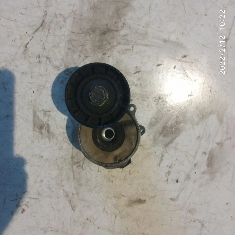 Alternator belt tensioner 55190813