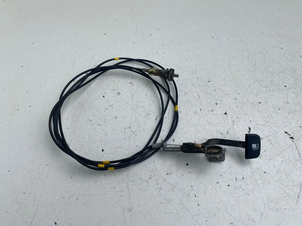 Fuel cap flap release cable