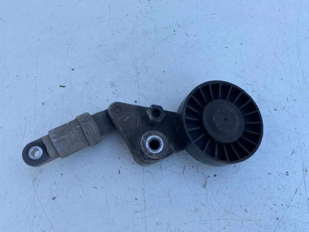 Alternator belt tensioner