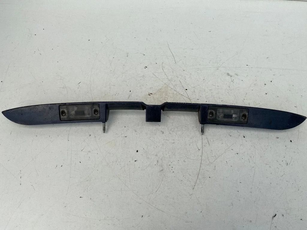 Trunk door license plate light bar