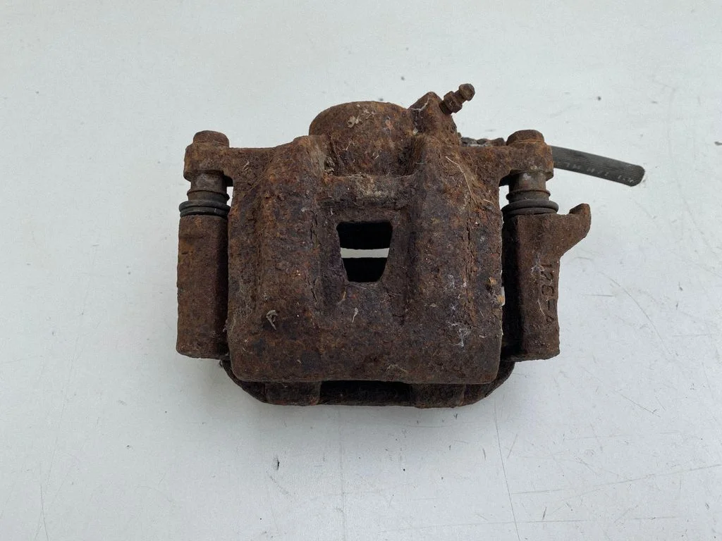 Front brake caliper – left