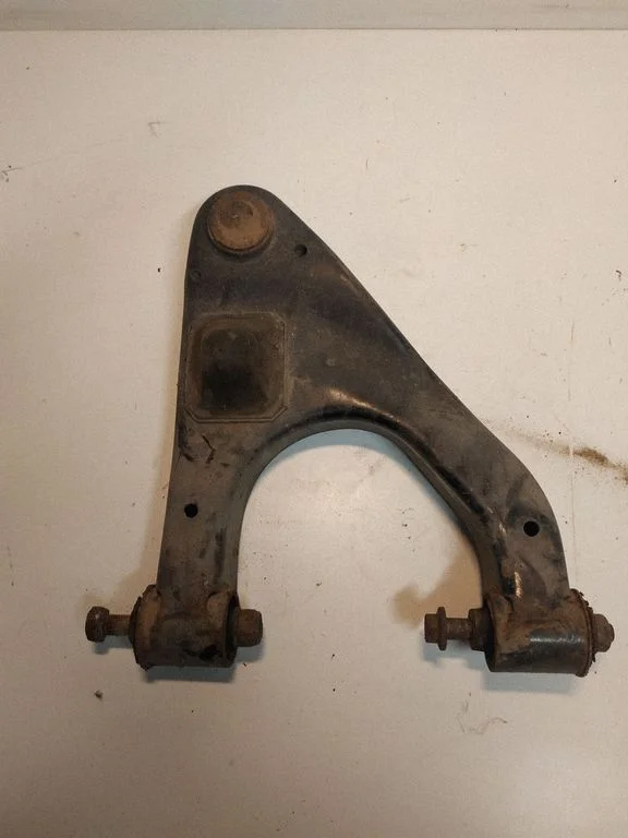 Rear upper control arm/wishbone – left