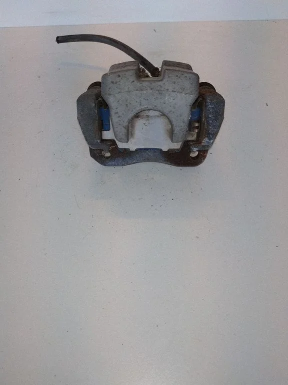 Rear brake caliper – left