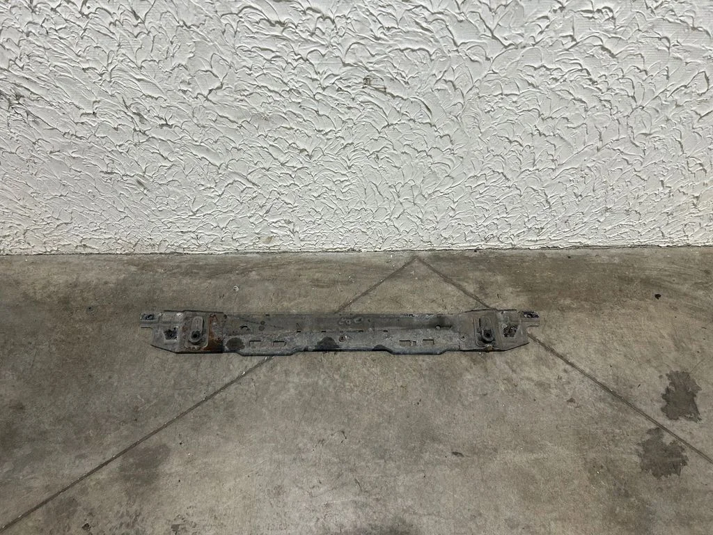 Bottom radiator support slam panel
