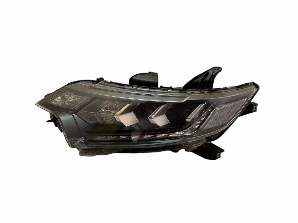 Headlight/headlamp – left