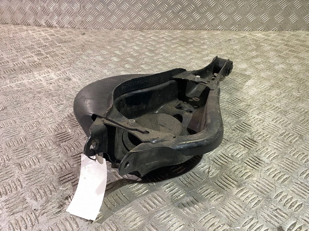 Rear upper control arm/wishbone – left