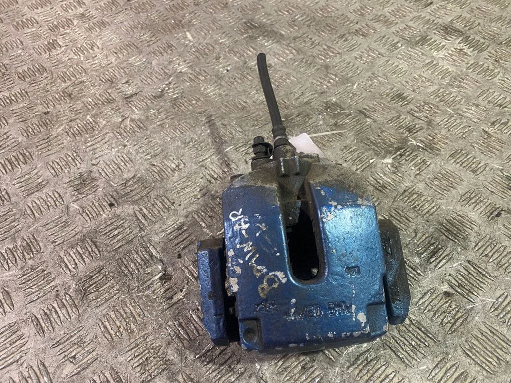 Rear brake caliper – left