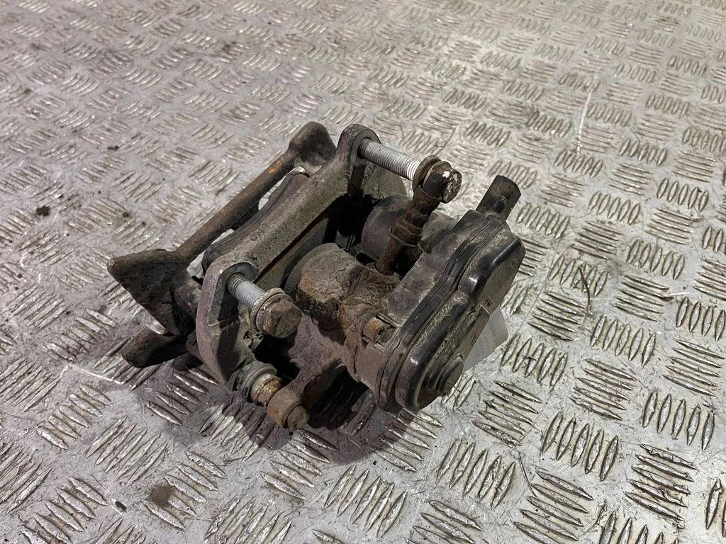Rear brake caliper – left