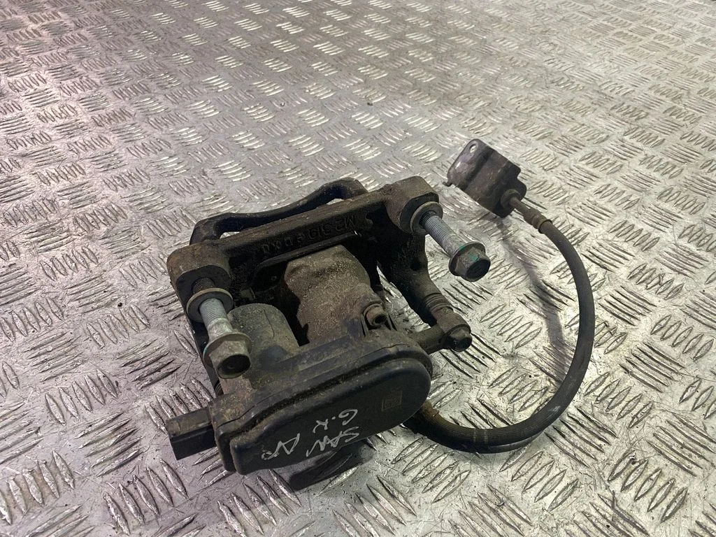 Rear brake caliper – left