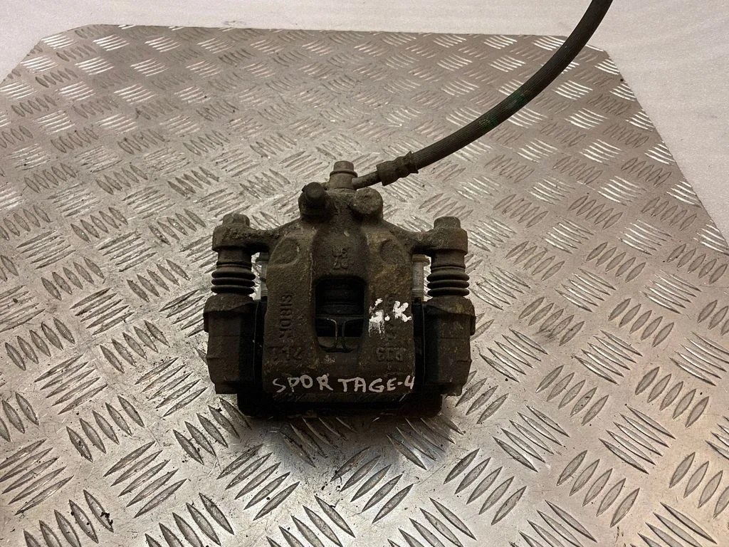 Rear brake caliper – left