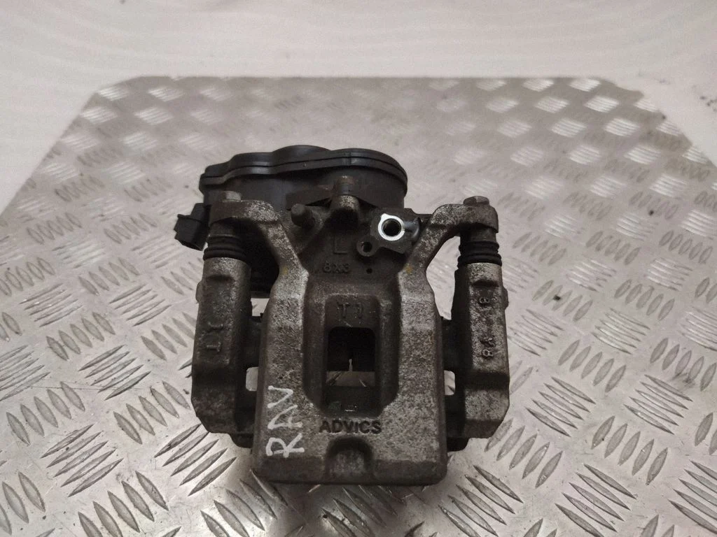 Rear brake caliper – left