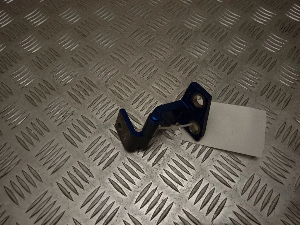 Front door lower hinge – left