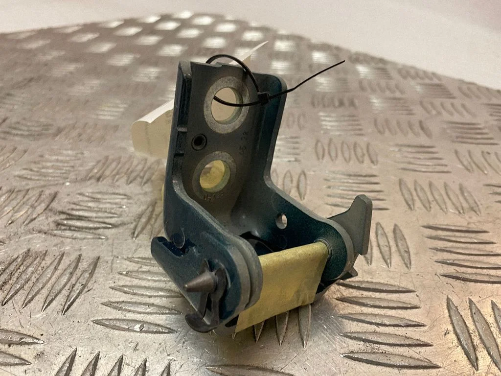 Front door lower hinge – left