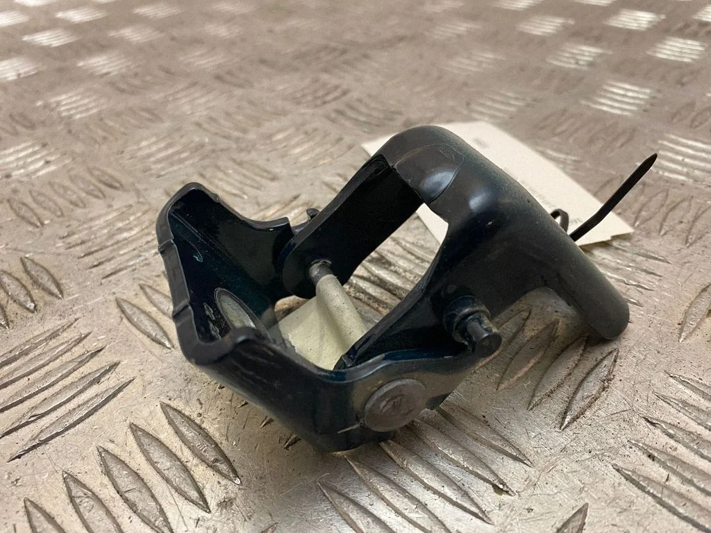 Rear door upper hinge – left