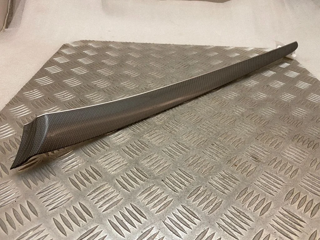 Front door trim bar K034AMCR4B45V