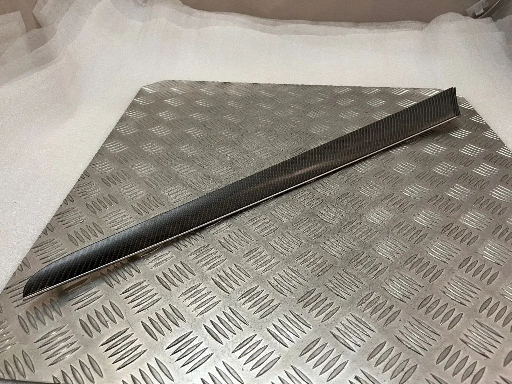 Front door trim bar K034AMCR4B45V