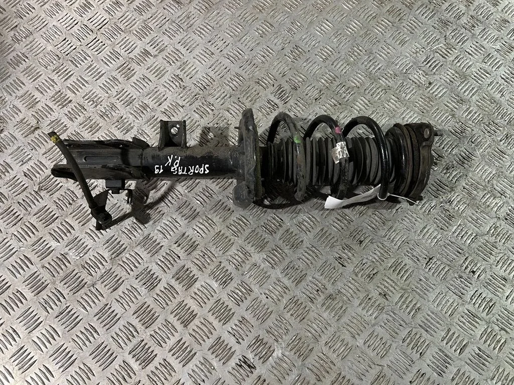 Front shock absorber with coil spring – left