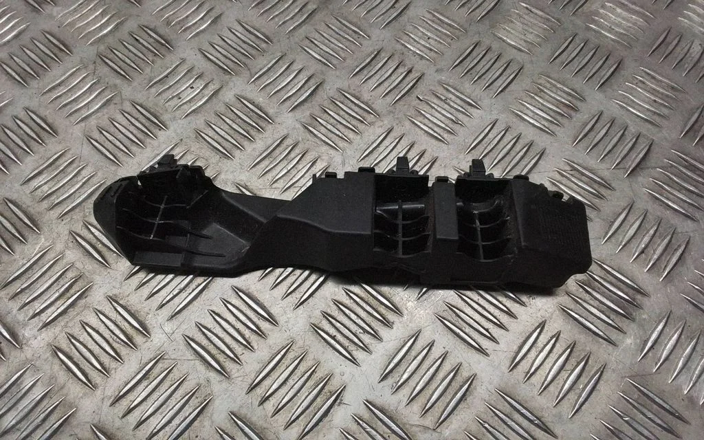 Front bumper mounting bracket 86551AT000