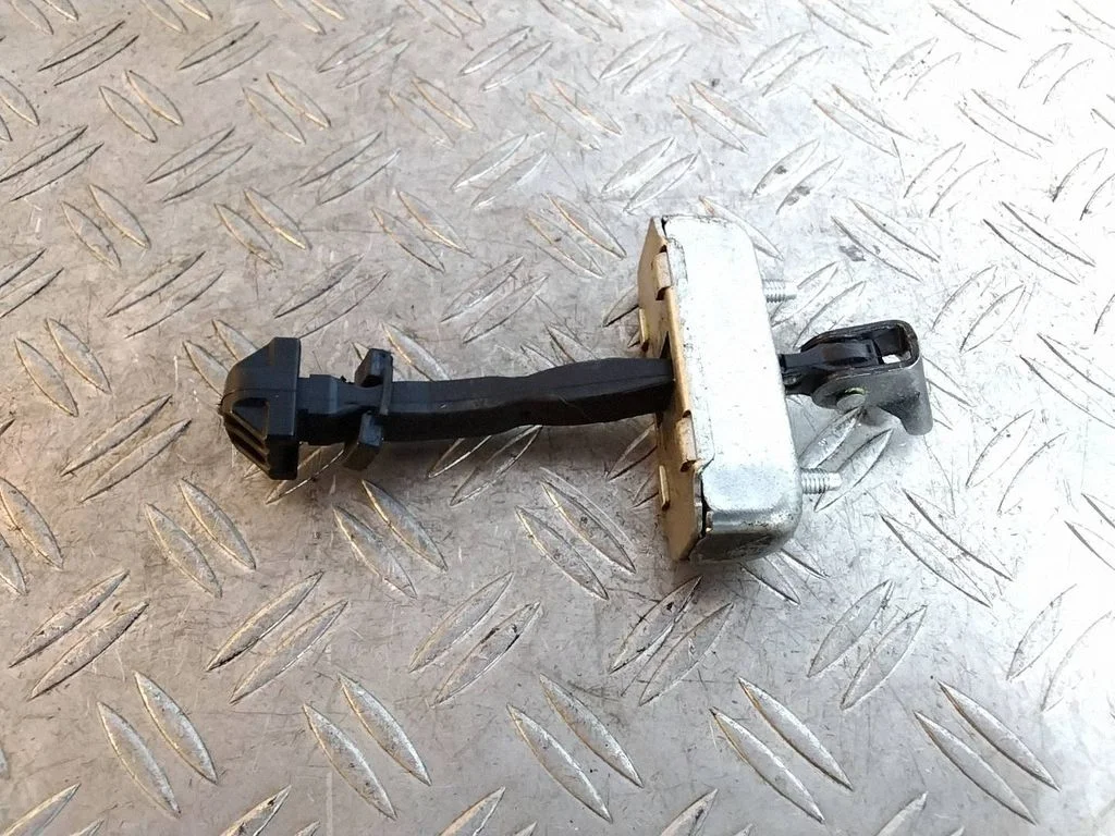 Rear door check strap stopper – Toyota Land Cruiser (J150) (2009-)