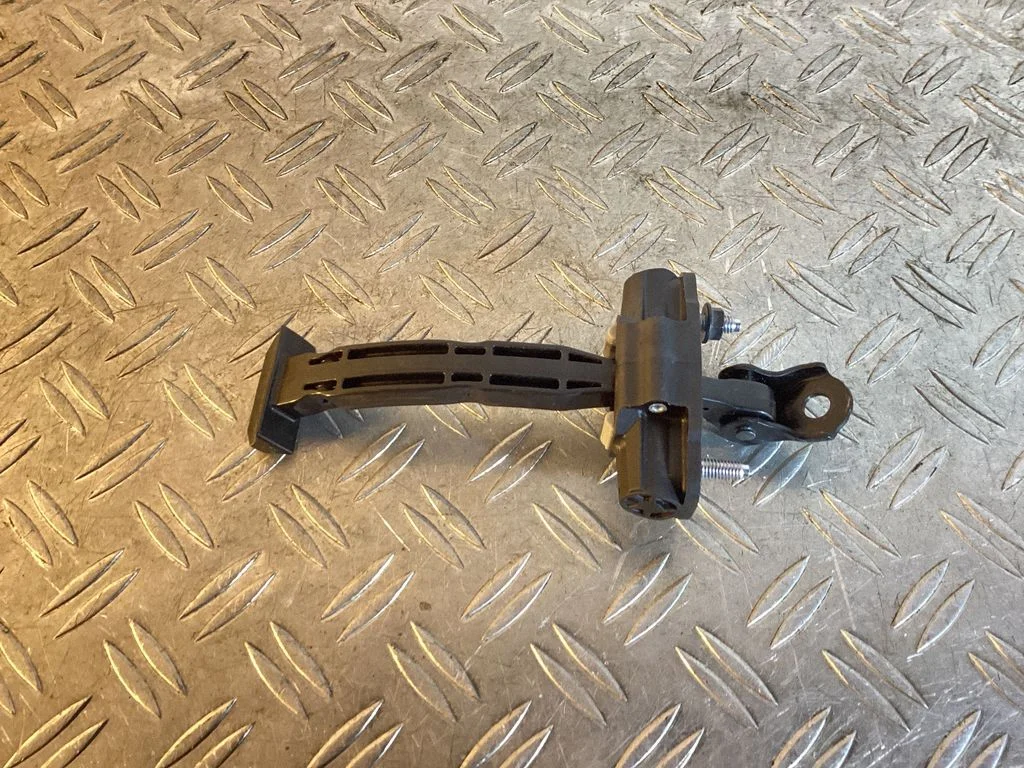Rear door check strap stopper – Tesla Model Y (2020-)