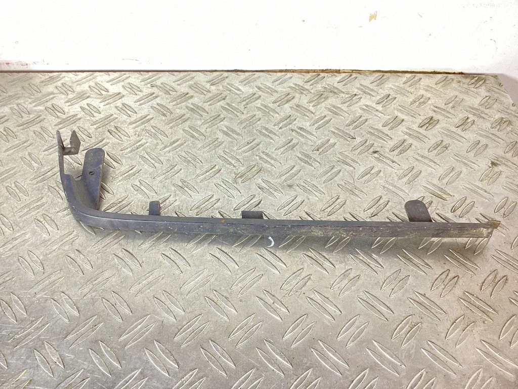 Under headlight/headlamp trim – Volvo 440 (1989-1996)