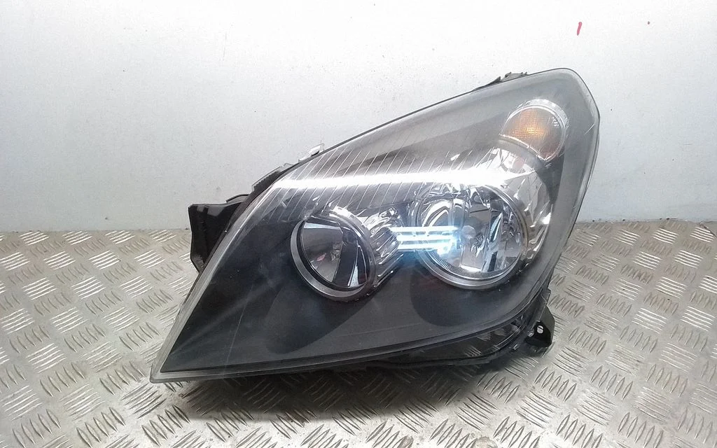 Reflektor 24451032 – Opel Astra H (2004-2012)