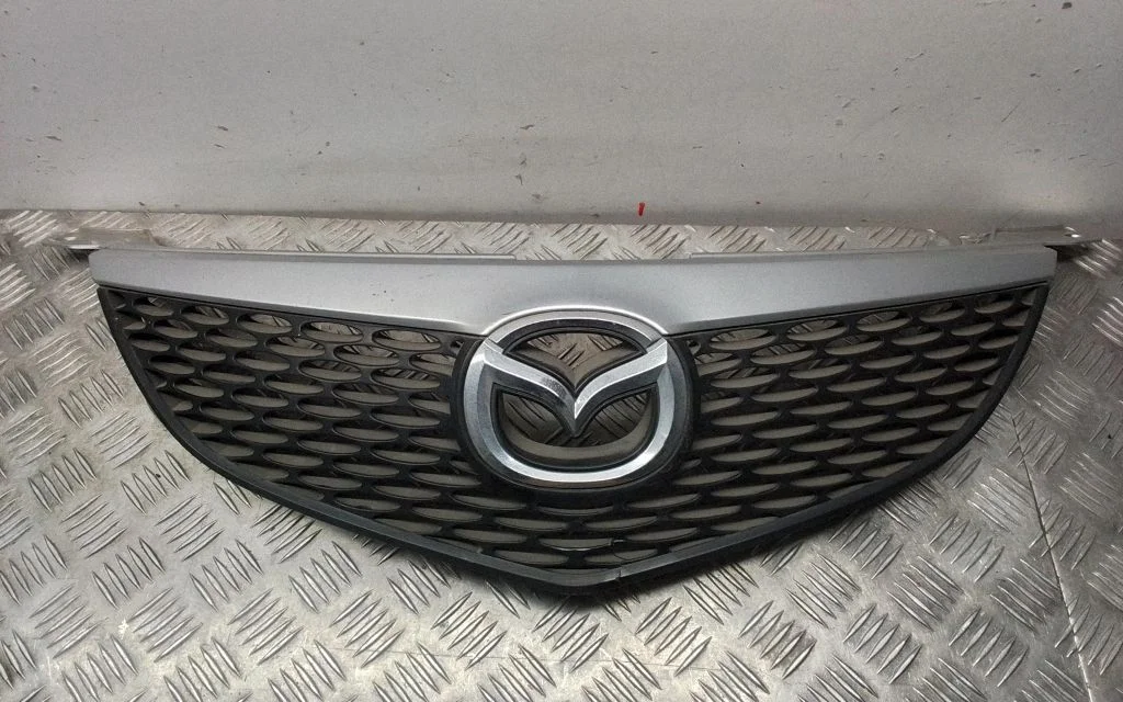Esistange ülemine radiaatorivõre – Mazda 3 I (2003-2006)