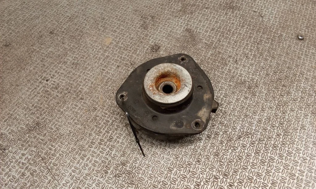 Front upper strut mount – left