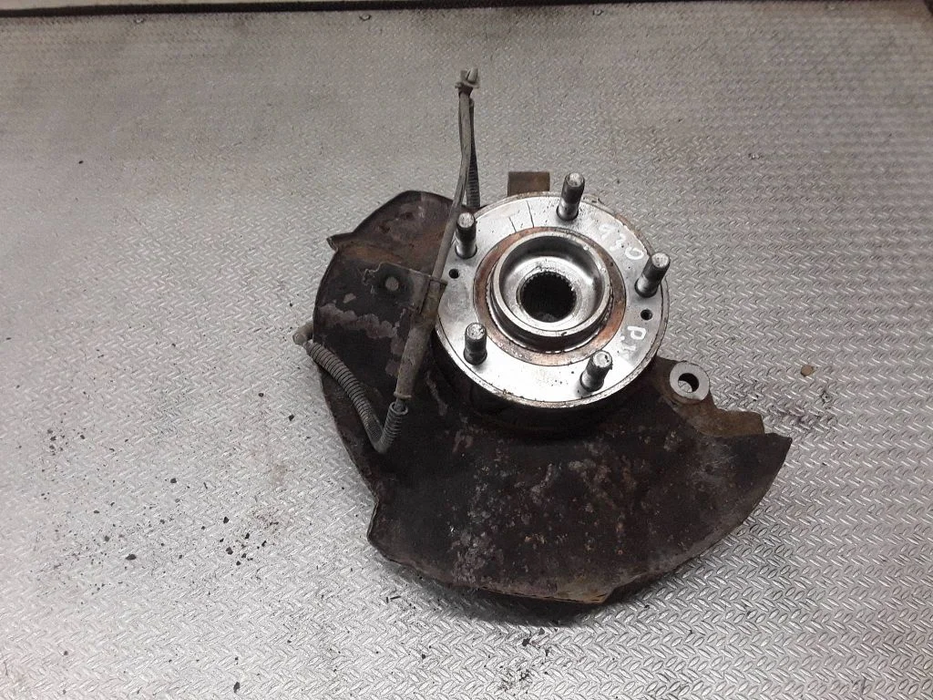 Front wheel hub spindle knuckle – left