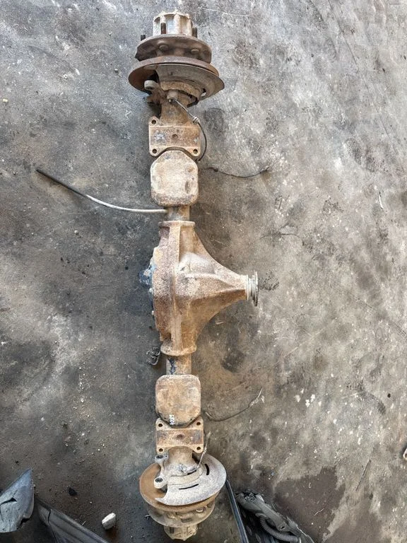 Rear axle beam with reductor
