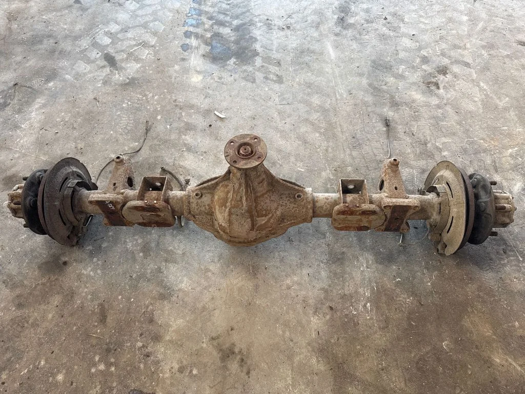 Rear axle beam with reductor