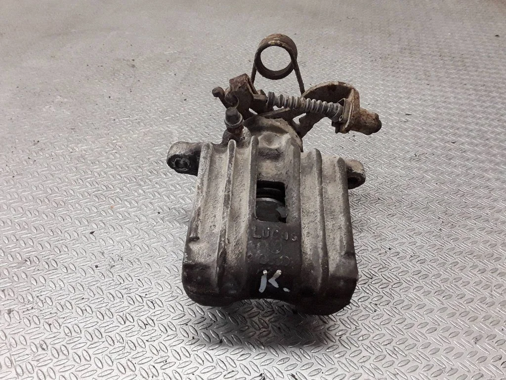 Rear brake caliper – left