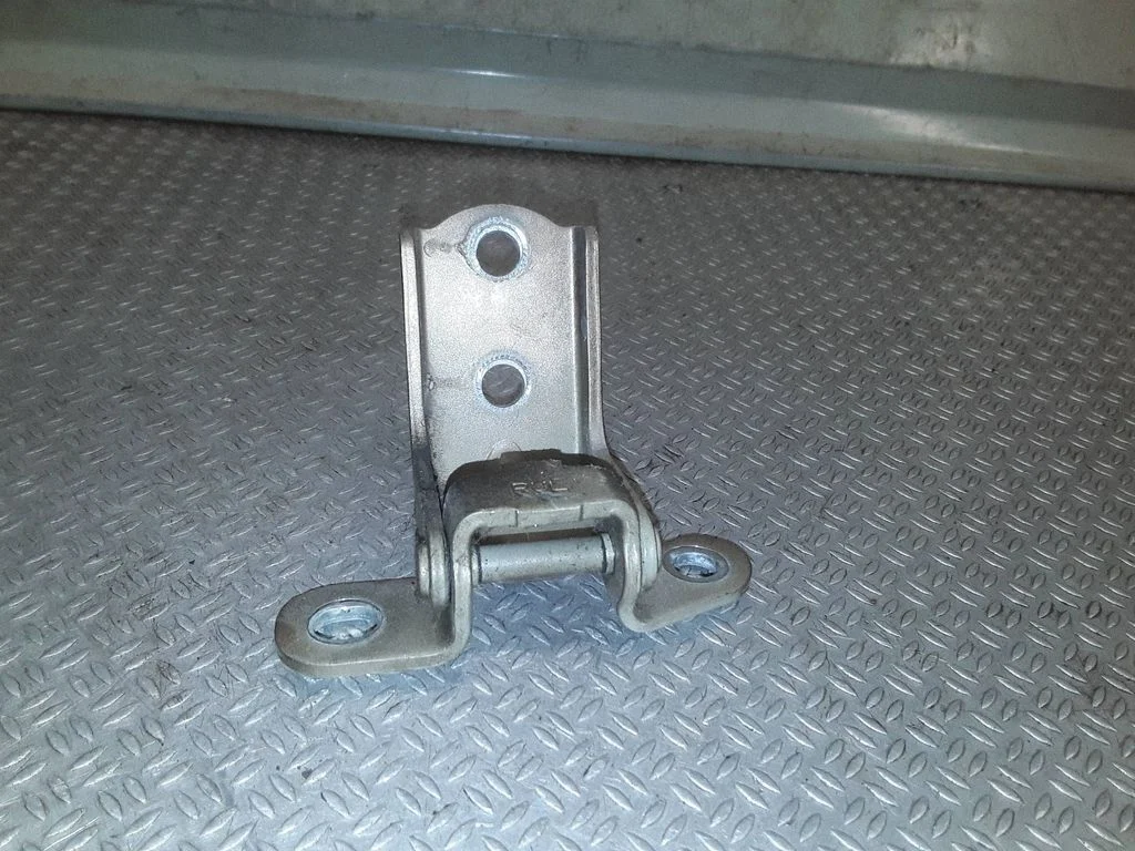 Front door upper hinge – left