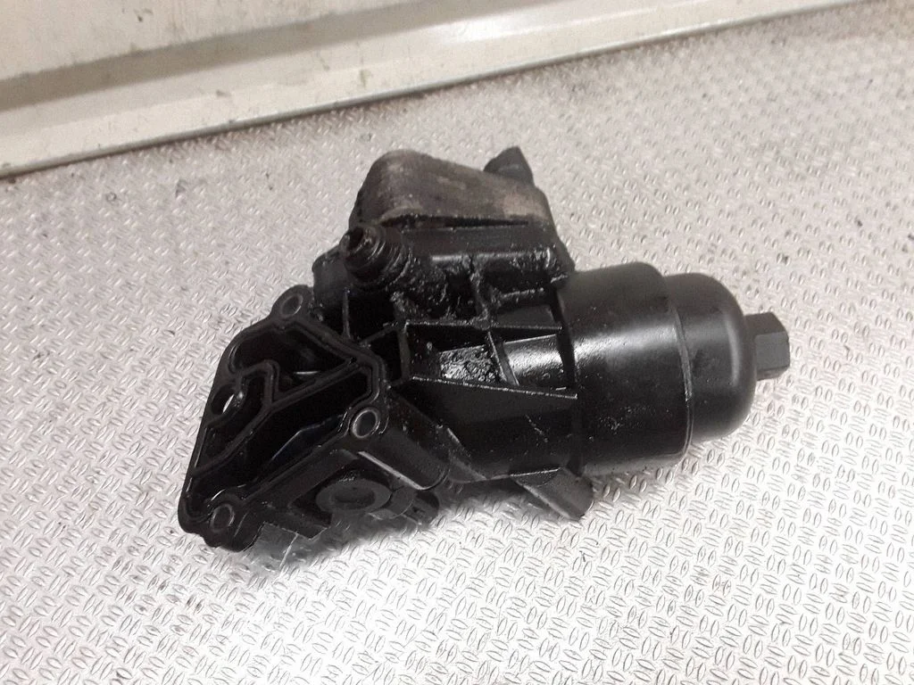 Oil filter mounting bracket 264102A300