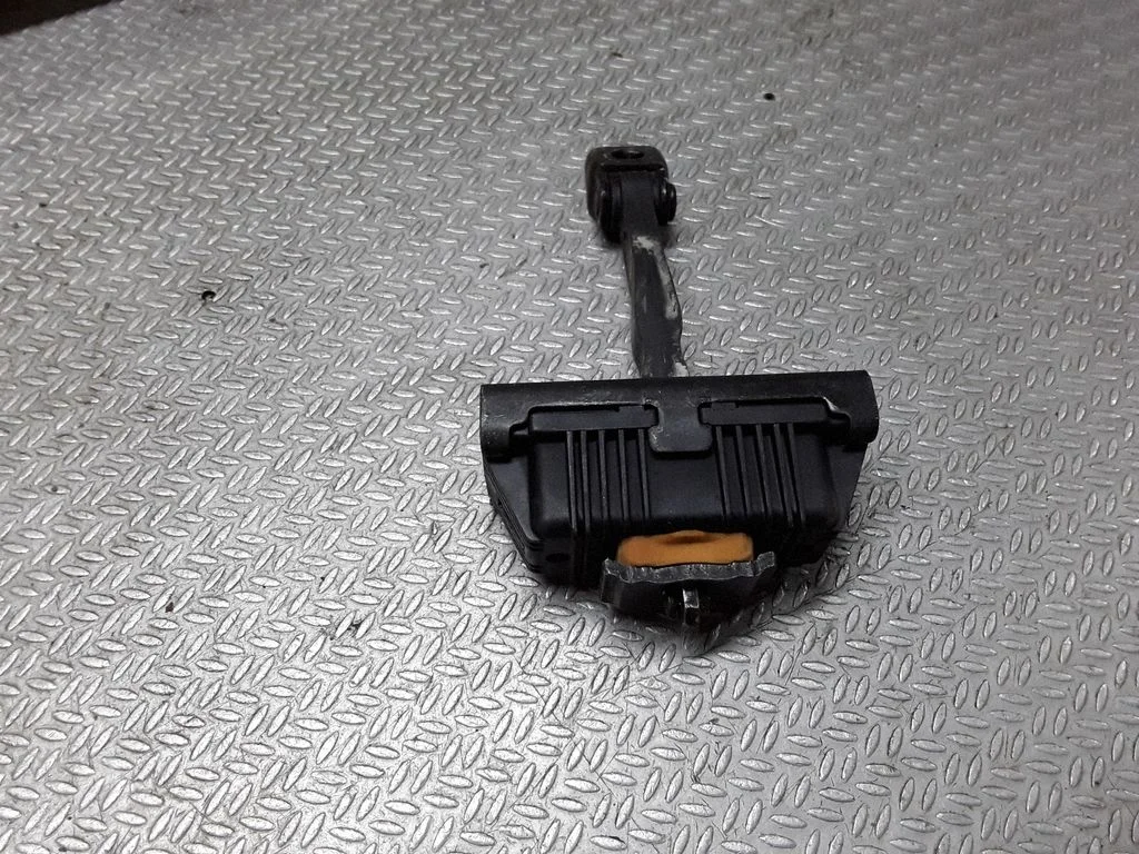 Front door check strap stopper 7164623