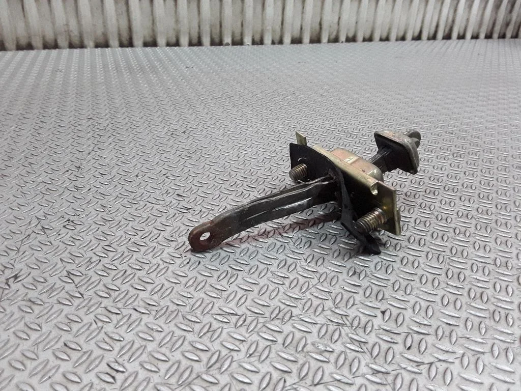 Front door check strap stopper – right