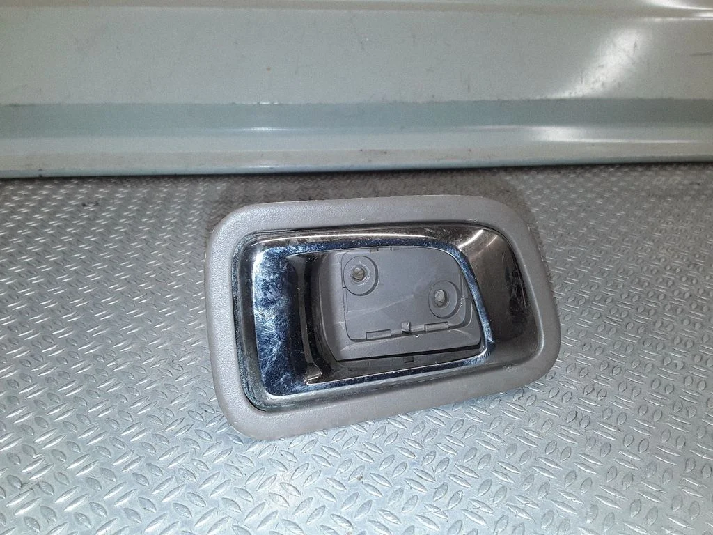 Rear door interior handle trim – left