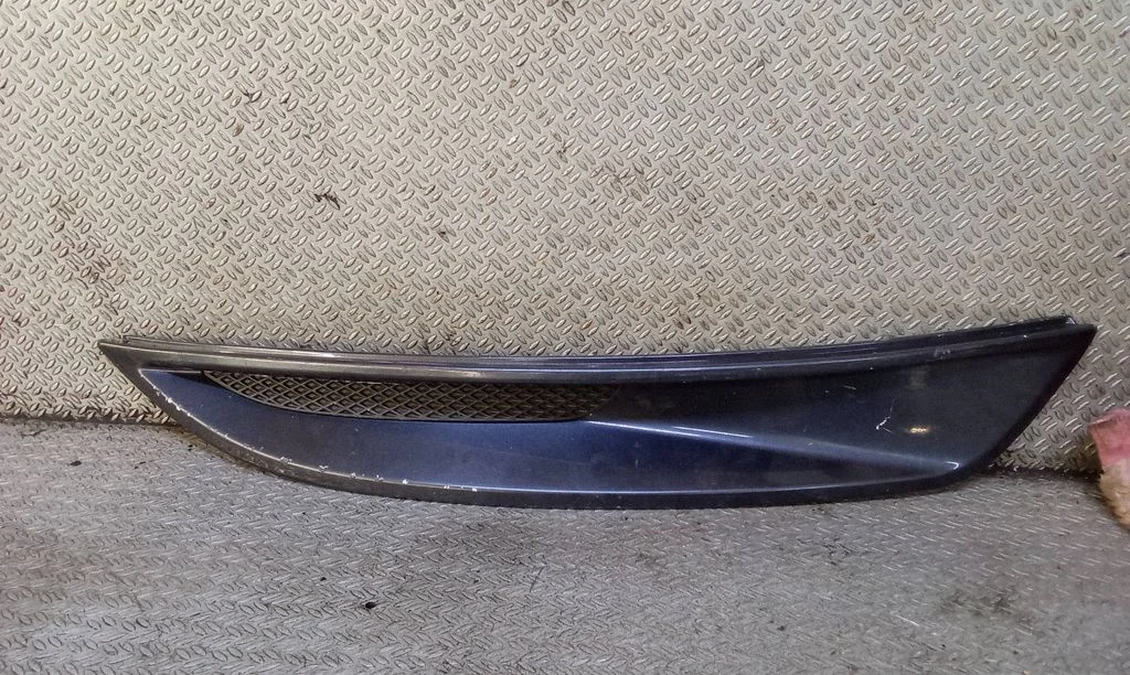 Under headlight/headlamp trim 8V4115A281A