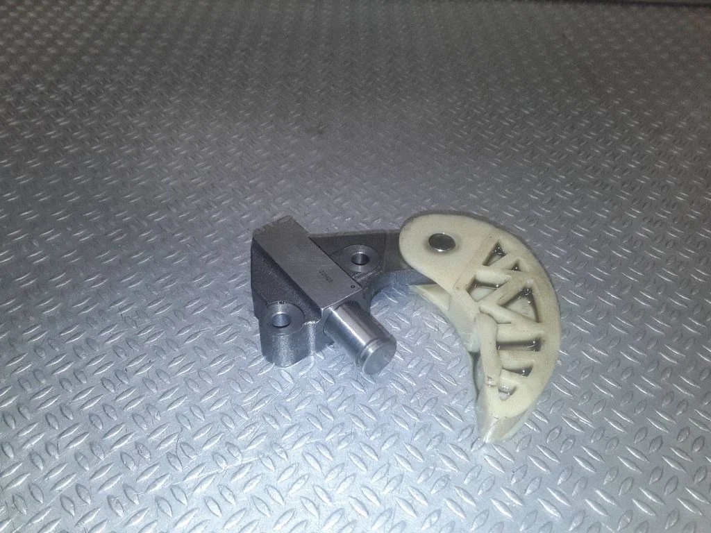Timing belt/chain tensioner