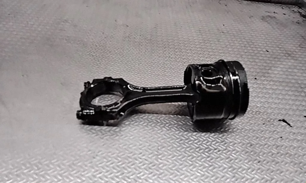 Piston with connecting rod