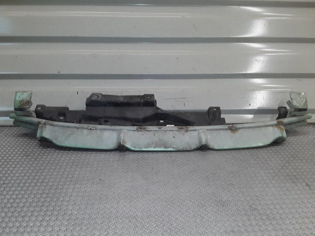 Bottom radiator support slam panel