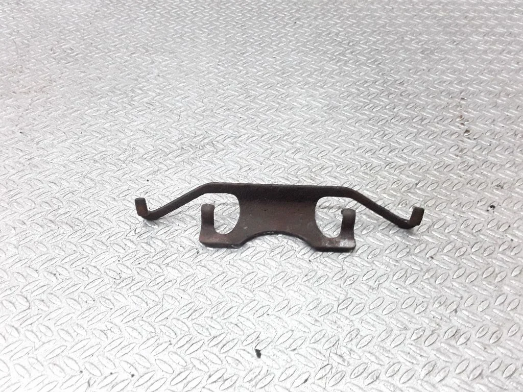Front brake pad spring