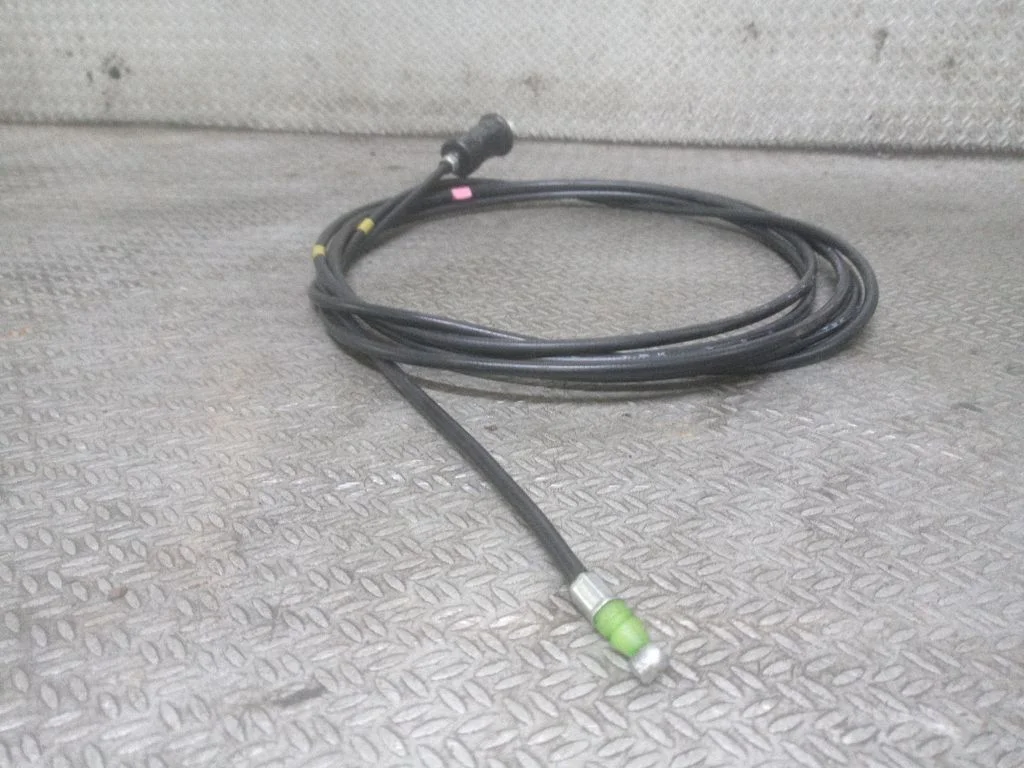 Fuel cap flap release cable