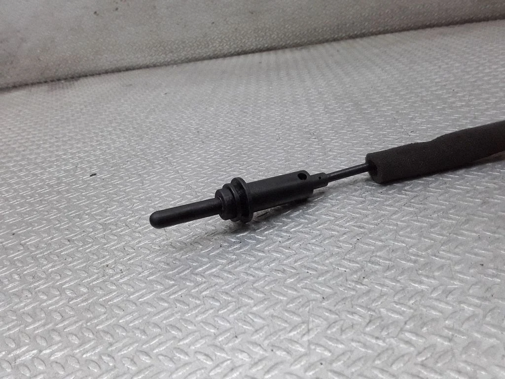 Fuel cap flap release cable