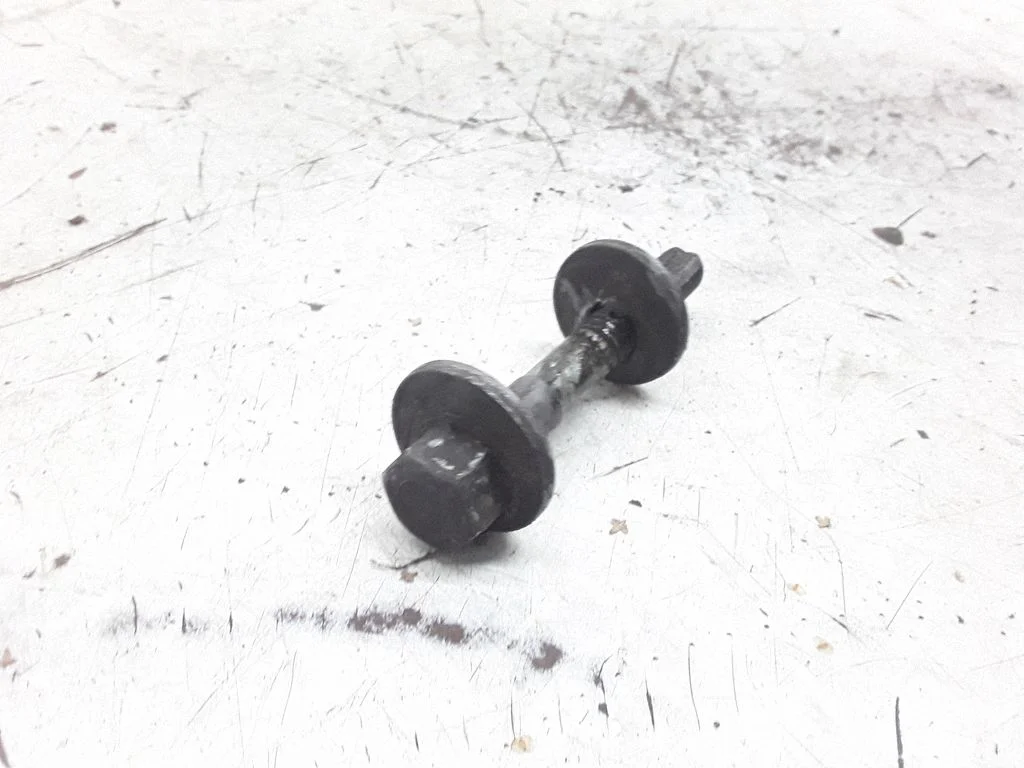 Front suspension camber bolt