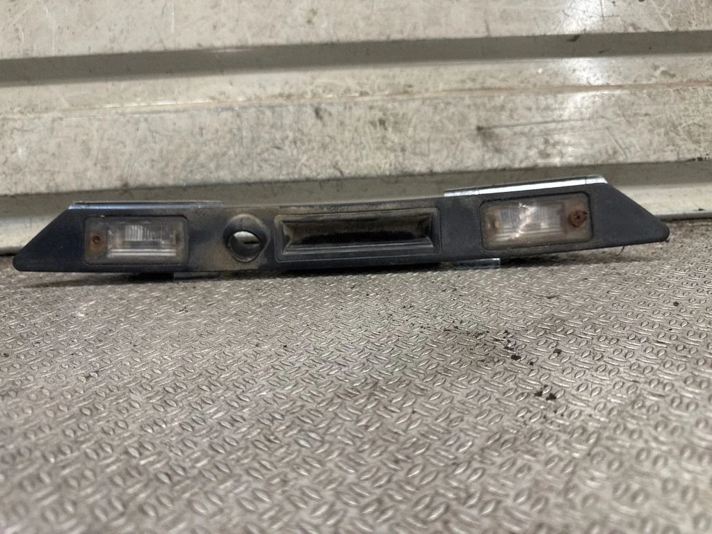 Trunk door license plate light bar – rear